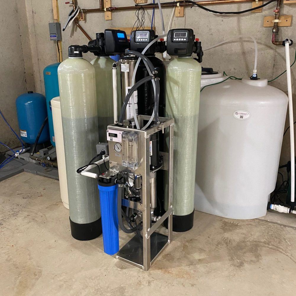 Mechanical room with twin softener tanks, reverse osmosis and storage tank