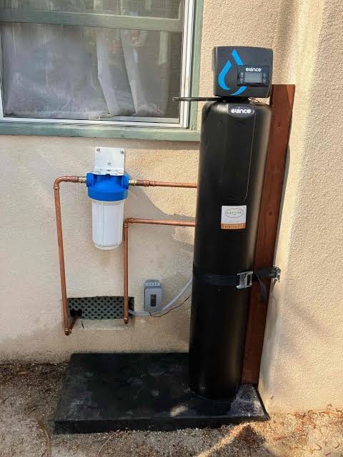 Water softener and sediment filter installed in a home